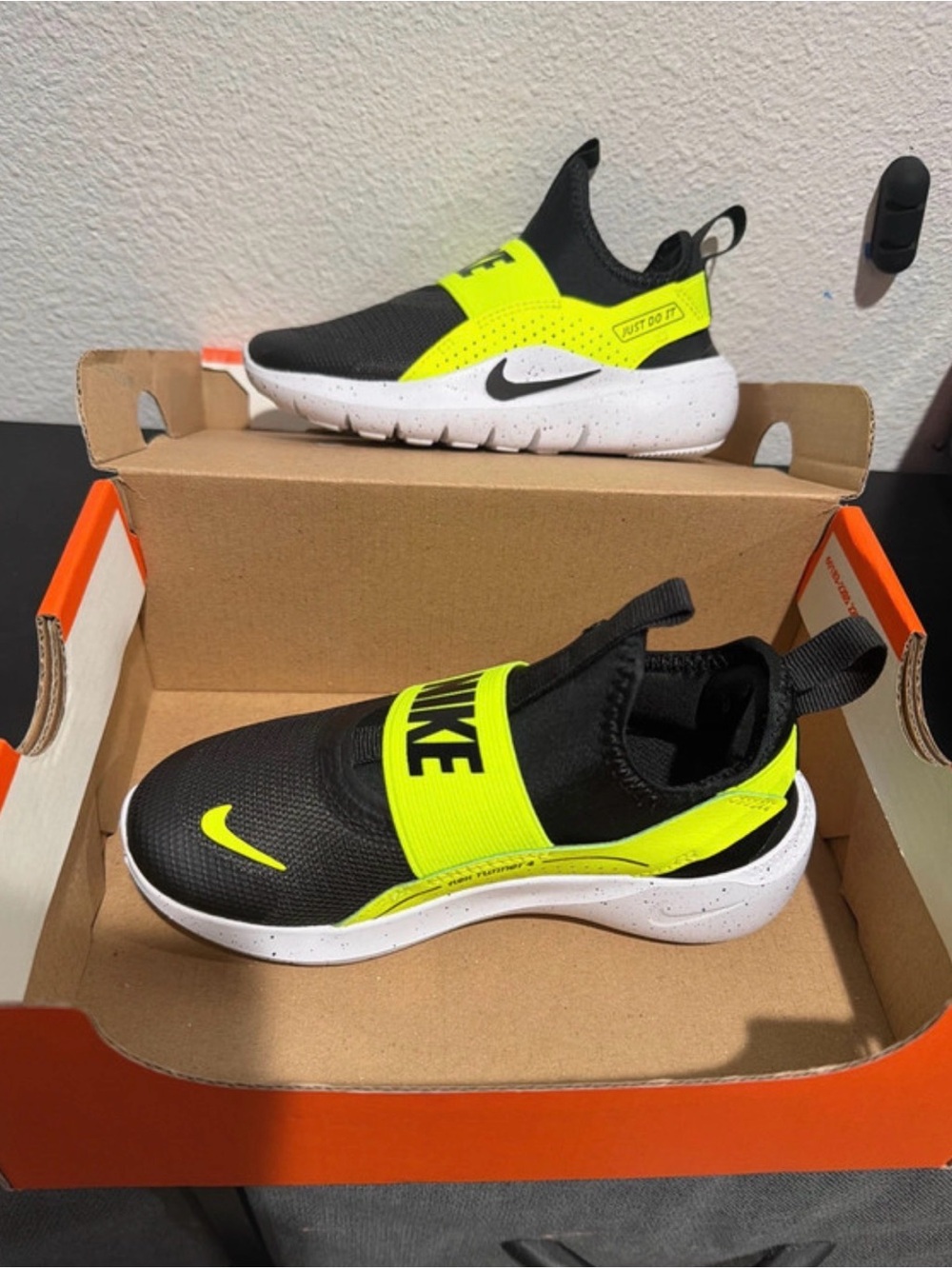 Nike Kids Slip-On Sneakers in Black and Neon Yellow